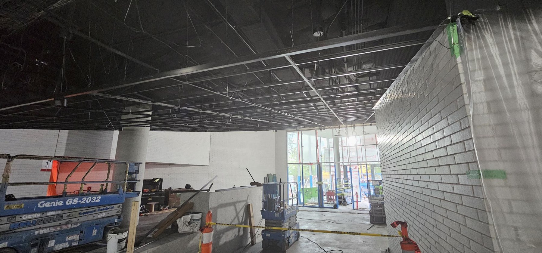 School of Biomedical Engineering, UBC Sloped black grid install for wood ceilings