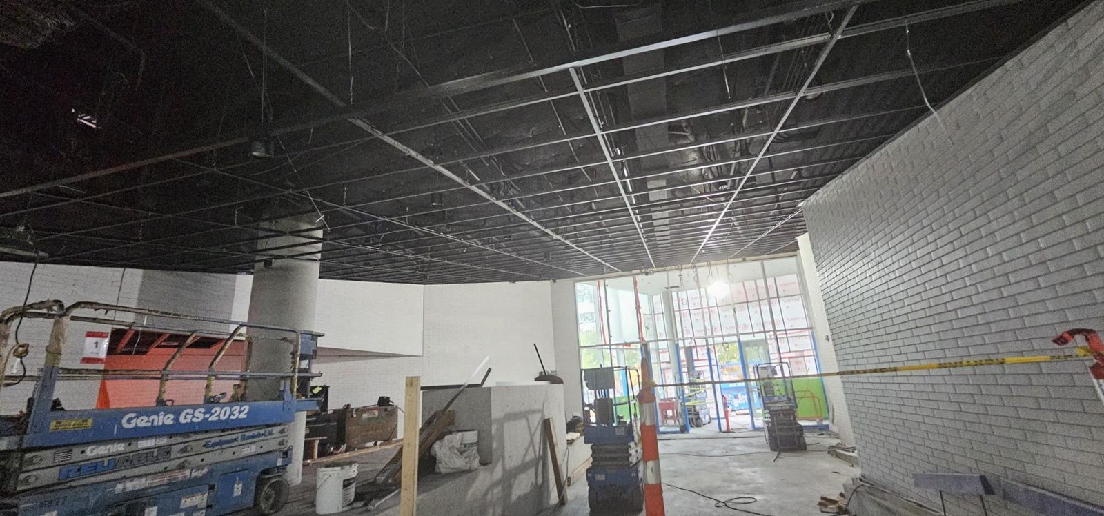School of Biomedical Engineering, UBC Sloped black grid install for wood ceilings