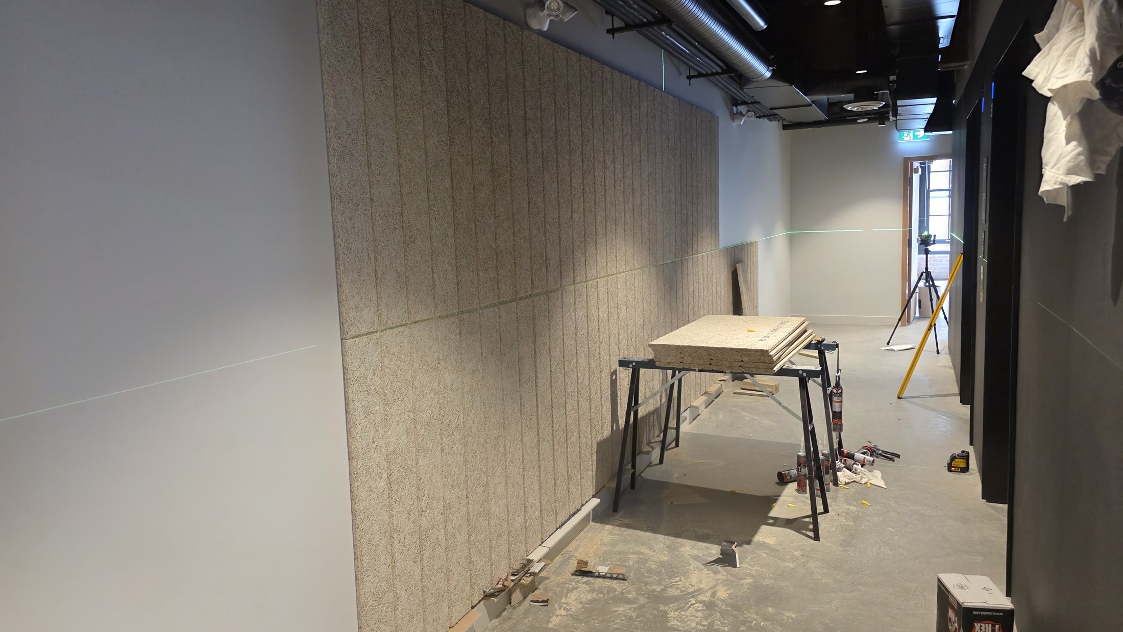 Tectum acoustic wall-panel installation in progress at 837 Beatty Street in Vancouver.