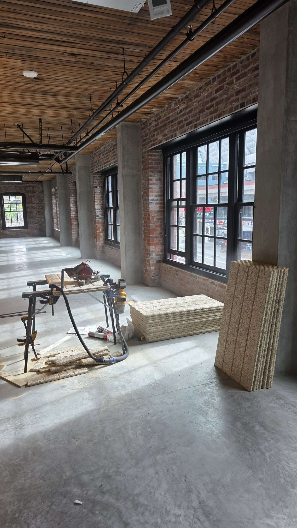 Tectum acoustic wall panels staged for installation at 837 Beatty Street.
