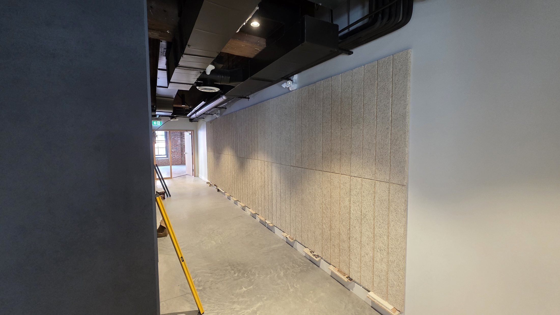 Completed Tectum acoustic wall-panel installation at 837 Beatty Street in Vancouver.