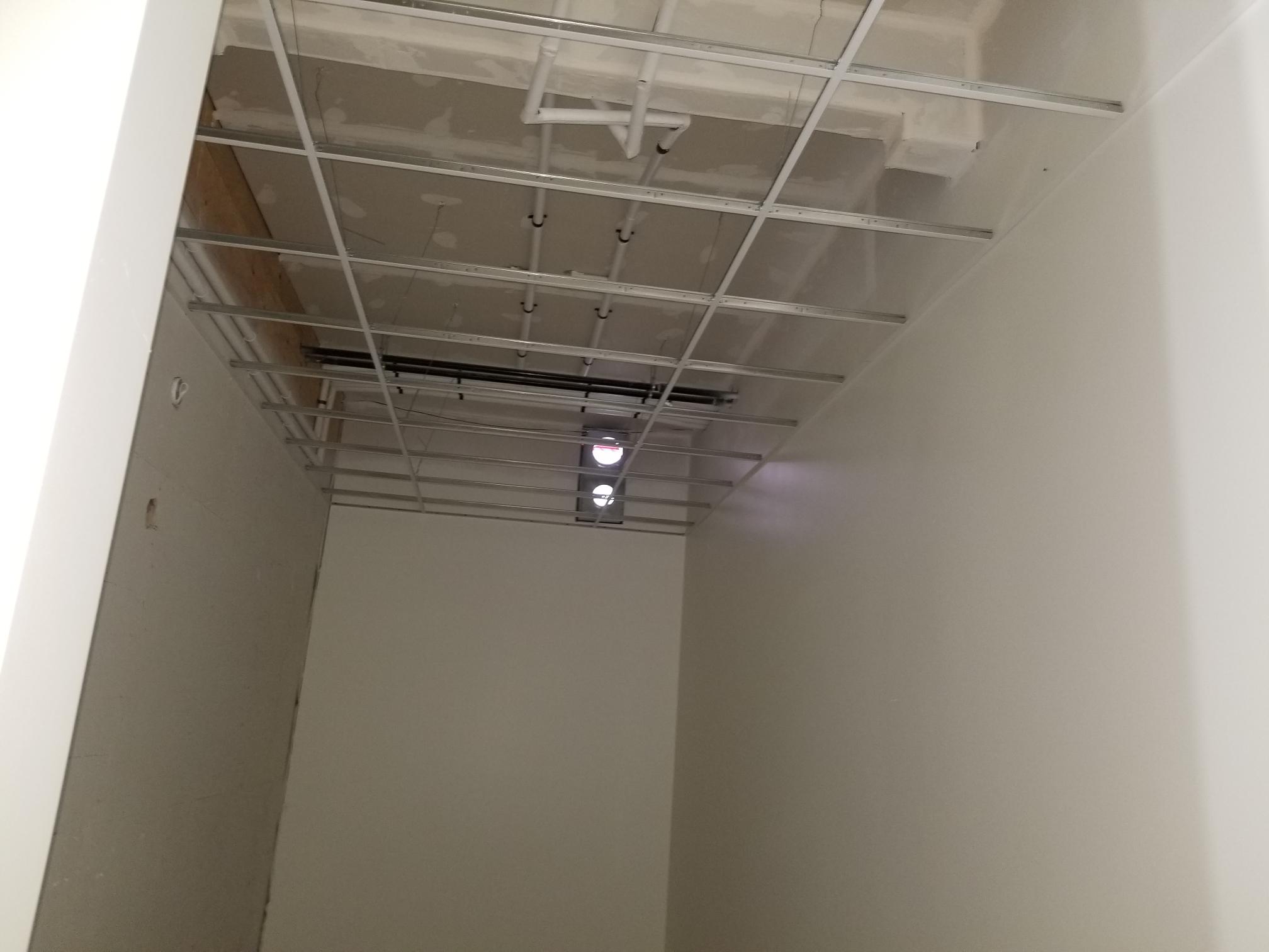 Chilliwack retail T-bar ceiling installation — archive view 1.