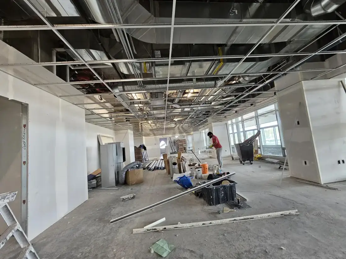 The wider interior while ceiling work is underway.