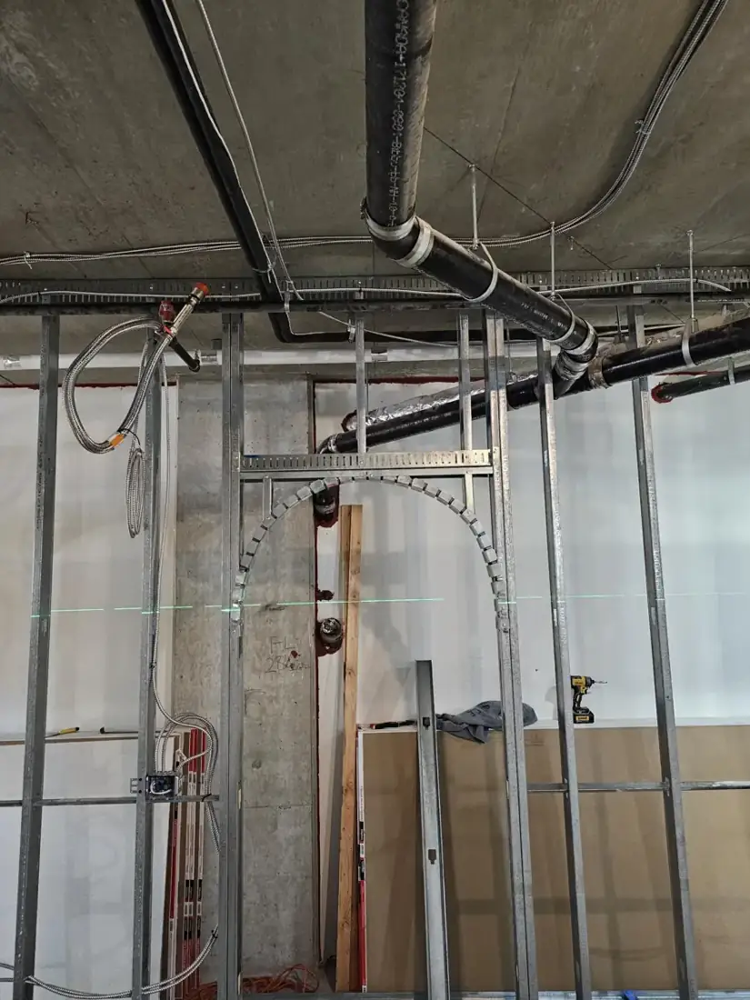 Curved framing detail before the finished interior surfaces. Photo: Matt McKenzie / Rambo Wall & Ceiling Limited. Curved framing detail before the finished interior surfaces. Photo: Matt McKenzie / Rambo Wall & Ceiling Limited.