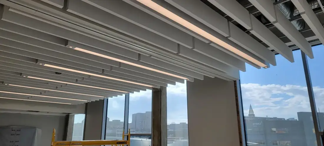 Repeating suspended baffles at the DP World interior.