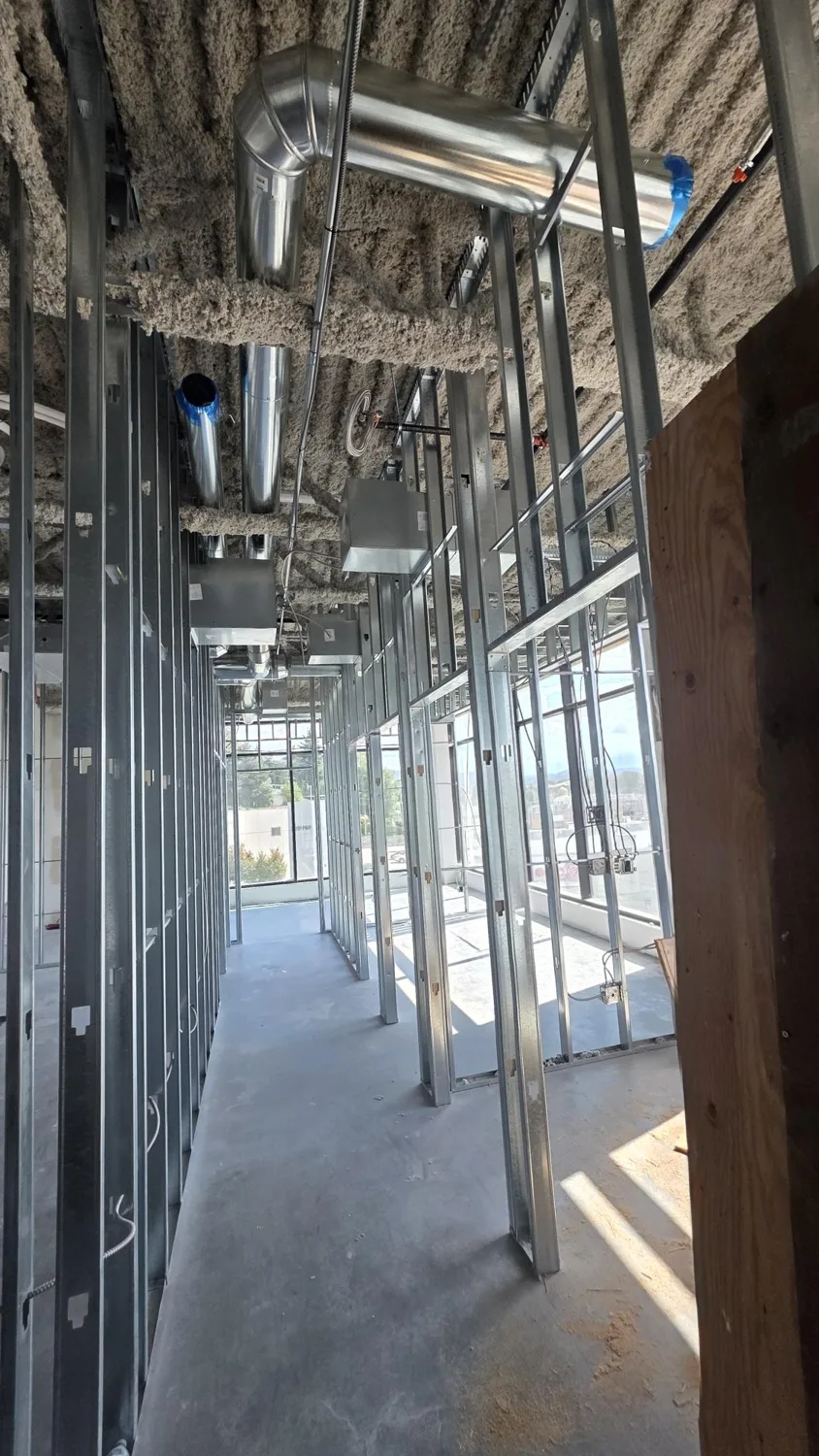 Metal stud partitions before drywall at 31999 Lougheed Highway in Mission