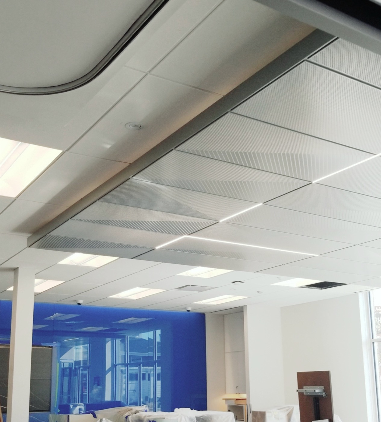 Completed curved specialty ceiling and acoustic panel installation.