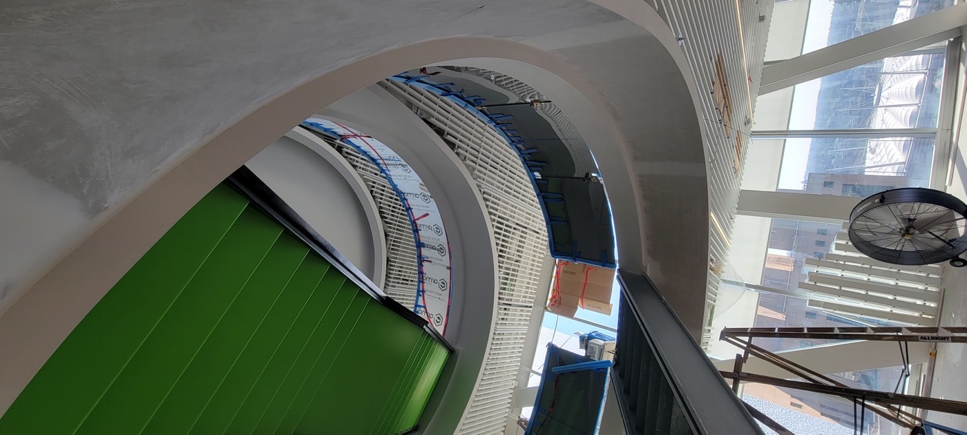 Tall curved architectural ceiling feature viewed from below.