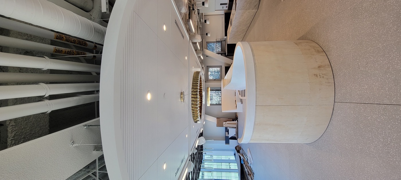 Completed circular ceiling detail with integrated downlights.