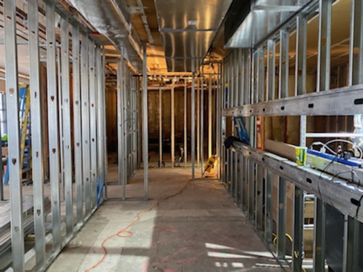 Steel stud corridor partitions during a commercial interior build-out.