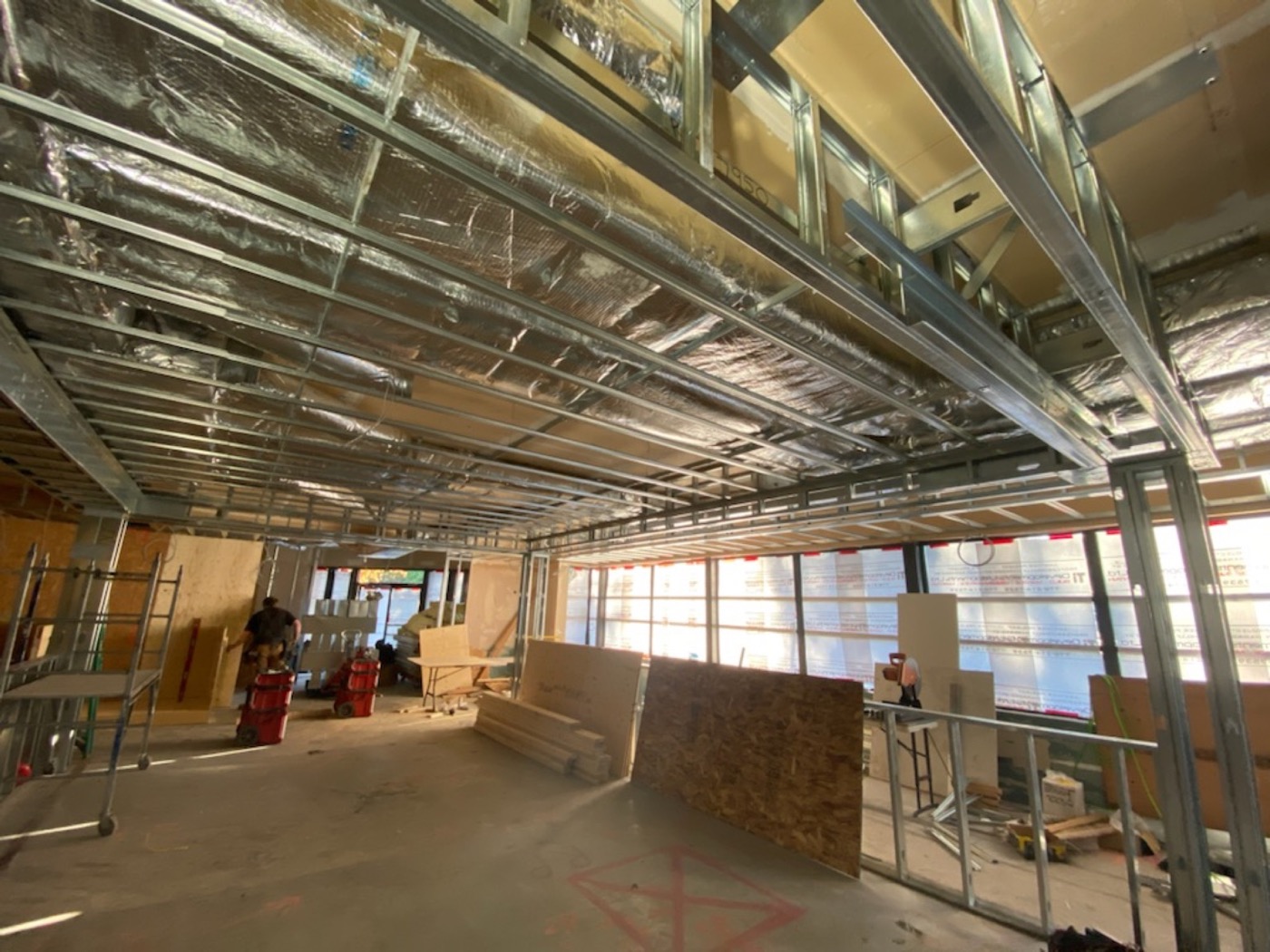 Commercial ceiling framing and building services before board installation.