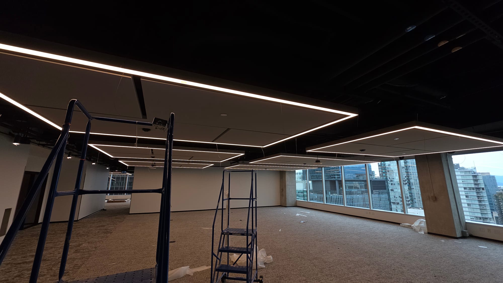 Wide view of suspended acoustic ceiling clouds installed for a Microsoft commercial interior.